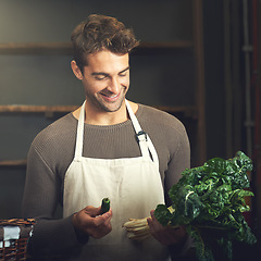 Image showing Food, happy man with vegetables and chef in kitchen in his home. Healthy or nutrition diet with spinach, ingredients or recipe and smiling male person with apron prepare green salad at his house