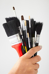 Image showing Paint brush, hand closeup and creativity tool for art or contractor work in a home. Creative start, painter and person or artist tools for house renovation, canvas construction and decor equipment