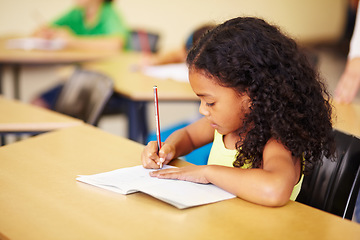 Image showing Education, learning and girl in a classroom, writing and focus with notes, book and homework. Female child, student and kid with development, growth and knowledge for the future, creative and exams