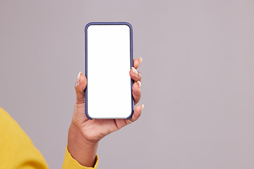 Image showing Phone screen, mockup and hand of woman isolated on studio background for mobile app or advertising space. Closeup of person or online user cellphone with mock up for website, contact or ux design