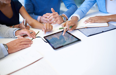 Image showing Hands, group and tablet on desk for teamwork, business people or planning strategy together in workplace. Team building, touchscreen and analysis for ideas, brainstorming or problem solving in office