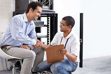 Image showing Server room, man or technician shaking hands for hardware maintenance success or fixing glitch in office. Handshake, contract or happy worker with an electrician or engineer for IT support or deal