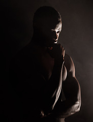 Image showing Black man, muscle silhouette and studio for thinking, anxiety and depression with art deco vision. Model, art aesthetic and depressed with strong body, alone or suffering with mental health in shadow