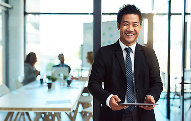 Image showing Portrait, office and asian businessman with tablet in office or standing with confidence, pride and happiness in corporate workplace. Man, manager or professional worker or employee with technology