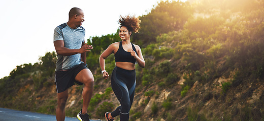 Image showing Fitness, exercise and couple running in nature by a mountain training for a race, marathon or competition. Sports, health and athletes or runners doing an outdoor cardio workout together at sunset.