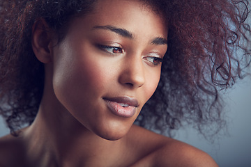 Image showing African woman, curly hair and thinking in studio with makeup, cosmetics and vision by background. Girl, model and wellness with skincare, natural aesthetic and glow on face with beauty by backdrop