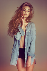 Image showing Portrait, sexy woman and denim jacket in studio, fashion and style with underwear, sensual clothing and seductive. Female model, beauty and revealing clothes with confidence, empowerment and attitude