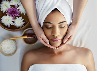 Image showing Woman, hands and face sleeping in massage, skincare or beauty spa treatment on bed above at resort. Top view of female relaxing with eyes closed for calm therapy, healthy wellness or cosmetic facial