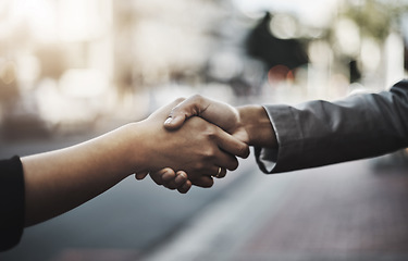 Image showing Business people, handshake and meeting in city for partnership, introduction or greeting outdoors. Hand of employees shaking hands for b2b, collaboration or agreement in deal or hiring in urban town