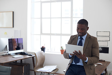 Image showing Business, black man and tablet in office for planning, connection and internet research in agency. Happy male worker, digital technology and scroll website for online information, insight and app