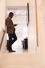 Image showing Business, man and and typing on smartphone in office corridor, online contact or digital technology. Black male worker texting on cellphone, social networking app or mobile search on media connection