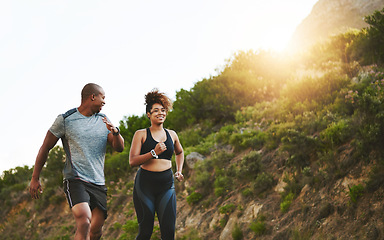 Image showing Fitness, nature and couple walking by a mountain training for a race, marathon or competition. Sports, exercise and African athletes or runners doing outdoor running cardio workout together at sunset