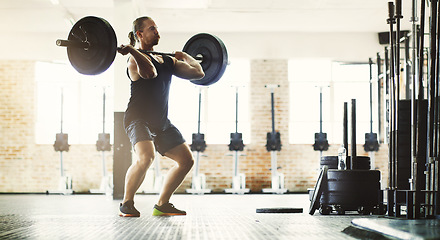 Image showing Fitness, workout and man with barbell in gym for training, exercise and health. Sports, wellness and male athlete or strong bodybuilder lifting weights for body muscle, power and strength exercising.