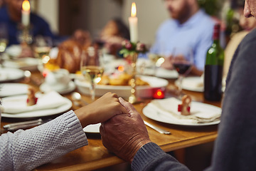 Image showing Prayer, thanksgiving and hand holding with family at table in dining room for holiday, food or worship. Praying, support and gratitude with closeup of people at home for kindness, dinner and love