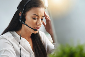 Image showing Call center, face or woman with headache, stress or burnout is overworked by telemarketing deadline. Depressed, sad or tired sales agent frustrated with migraine pain in customer services office