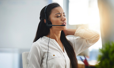 Image showing Stress, burnout or woman in call center with back pain injury while working in telecom help desk office. Consultant, injured agent or tired sales girl with joint pain emergency, fatigue or accident