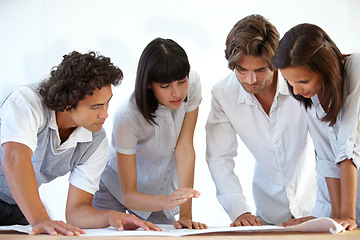 Image showing Business people, architect and team with blueprint for construction planning, layout or ideas at office. Group of contractors looking at floor plan or building document for industrial architecture