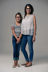 Image showing Portrait, mother and girl embrace in studio together on gray background or happy, preteen daughter and mommy with glasses. Family love, single mom and child or loving mama relationship with care