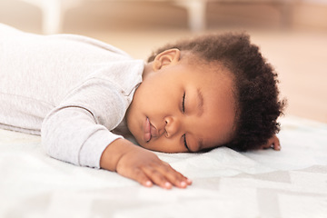 Image showing Adorable, bed and baby sleeping in home on blanket for rest, nap time and dreaming in nursery. Childcare, newborn and cute, tired and African child in bedroom sleep for comfort, relaxing and calm