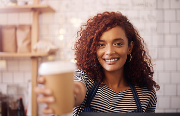 Image showing Portrait, woman and smile of waitress with coffee cup in cafeteria, restaurant and small business store. Happy female barista, server and giving cappuccino, drinks order and friendly service in shop