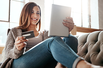 Image showing Happiness, tablet and credit card, woman on sofa in living room and internet banking or fintech in home. Technology, online shopping payment and girl on couch surfing retail website or digital shop.