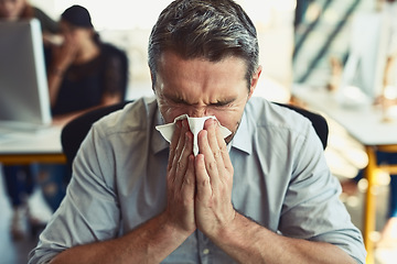 Image showing Sick businessman, tissue and blowing nose with allergies, flu or fever from illness at the office. Man employee with cold virus, allergy or sinus in sneeze suffering disease or symptoms at workplace