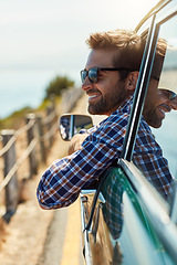 Image showing Road trip, travel and man with smile in car driving for adventure, summer vacation and holiday. Transportation, window and happy male person in motor vehicle for freedom, journey and relax by ocean