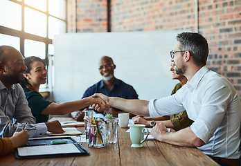 Image showing Business people, meeting and handshake for deal, agreement and collaboration. Smile, shaking hands and employees in partnership, congratulations or b2b, group acquisition and thank you in office.