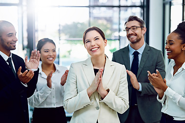 Image showing Business, woman and employees with applause, promotion and achievement in the workplace. Partners, men and women clapping, celebration and support for collaboration, teamwork or happiness with growth