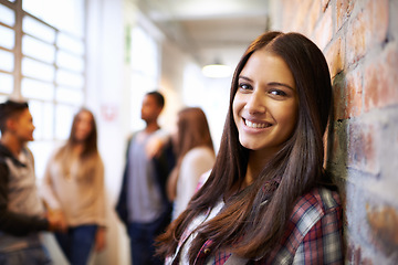 Image showing Education, happy and portrait of woman in college hallway for studying, learning and scholarship. Future, happy and knowledge with student leaning against wall for university, relax and campus