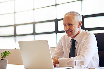 Image showing Laptop, smile and research with a business man in the office, working online to finish a project at his desk. Computer, technology and email with a mature male manager at work for company strategy