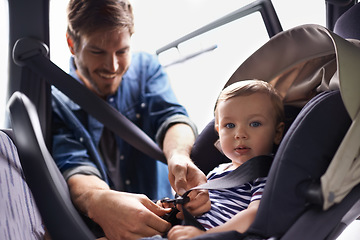 Image showing Safety, car seat and belt with father with baby for transportation, security and drive. Travel, protection and caution with man fasten strap on toddler in vehicle for responsibility and road trip