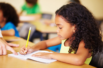 Image showing Child, writing and hand of teacher helping student at school for education, learning or development. Woman teaching girl with notebook, pencil and knowledge in a classroom with support at desk