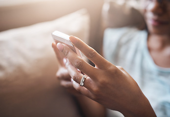 Image showing Relax, hands or woman typing on a phone for social media, searching content or notification at home. Closeup, browsing website or person posting, chatting or texting on online networking mobile app