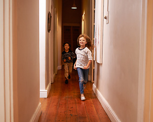 Image showing Fun children, family and hall running in new home feeling excited with happiness and game. Sibling, love and playing youth of kids together in a house with a smile and joy of siblings with excitement