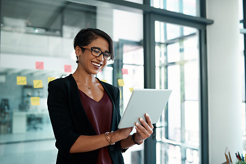 Image showing Business, woman and tablet typing for email, internet research or browsing for ideas, planning or communication. Female expert, corporate or designer scrolling, reading or working on social network