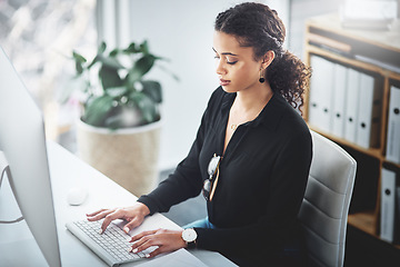 Image showing Business, typing and a woman with an email on a computer, research or secretary work. Analytics, desk and African female receptionist with pc in an office for communication, connectivity and working