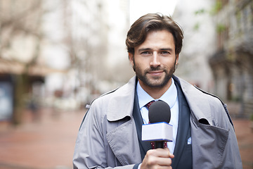 Image showing Portrait, broadcast and a man with a microphone in the city for an interview or tv journalist. Smile, media and a male reporter talking with a mic for press, anchor job and reporting the news