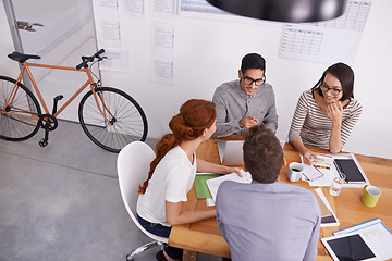 Image showing Team in conference room, creative people in meeting with collaboration, project planning and top view. Brainstorming, teamwork and strategy discussion in workplace, young men and women work together