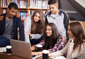 Image showing University, friends and people in library on laptop for online research, studying and learning. Education, academy and happy men and women students on computer for knowledge, internet and website