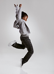 Image showing Talent, hip hop and young boy dancer dancing isolated in a white studio background in a pose feeling excited. African, urban and kid or child with energy and skill ready for breakdance performance