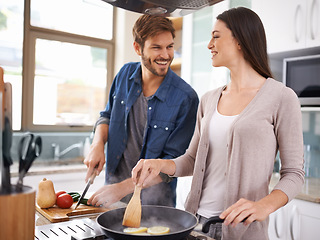 Image showing Happy couple, food and cooking together in a pan in the kitchen with healthy organic ingredients for dinner at home. Man helping woman with smile in happiness making meal with vegetables on stove