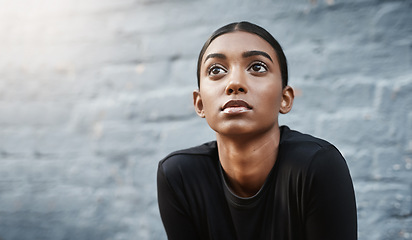 Image showing young woman, workout and thinking of training or routine or fitness and isolated on grey wall outdoors. Exercise, marathon and female runner or vision for wellness or outside and mock up background