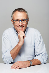 Image showing Portrait, business and mature man with a smile, confident and manager against a studio background. Face, happy male person and employee with happiness, skills and professional with career and success