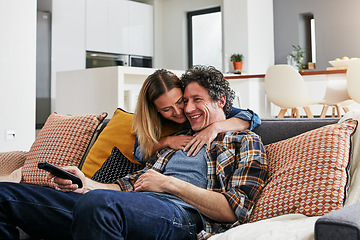 Image showing Happy, couple and hug for watching tv in home, cable movies and news show of film media in lounge. Mature man, woman and love with television remote, subscription and connection to streaming platform