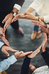 Image showing Teamwork, solidarity and business people with their hands together in a circle for unity. Collaboration, friends and top view of multiracial employees with connection for team building in the office.