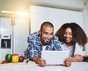 Image showing Couple, tablet and cooking food in kitchen at home with blog, internet website and online connection. Happy African man, woman and digital recipe for reading instruction of healthy vegetarian meal