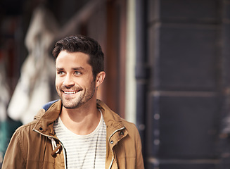 Image showing Street, urban fashion and happy man on sidewalk with smile on face, mockup and sunshine outside cafe. Happiness, streetwear and hipster male model walking in city, relax and sightseeing on holiday.