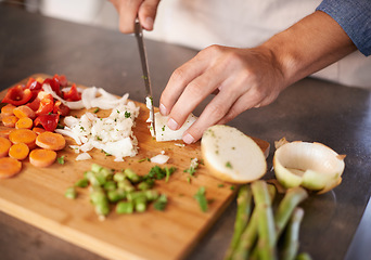 Image showing Chopping board, hands and man with vegetables, closeup and prepare a healthy meal at home. Zoom, male person and chef in a kitchen, vegan diet and nutrition with organic food, dinner and vegetarian