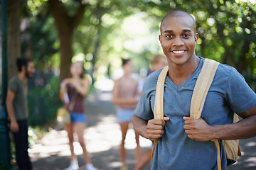 Image showing Man, student and portrait with backpack by a campus park with a smile and ready for study. Happiness, young and African male face in college and university outdoor with education and school bag